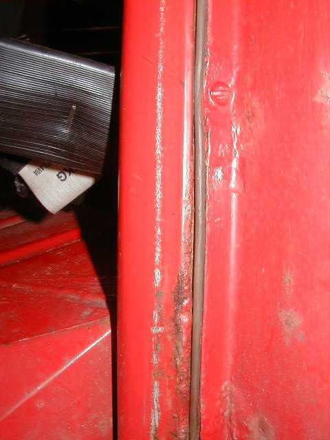 Picture 1 Badly rusted C-pole, covered by the rear fender